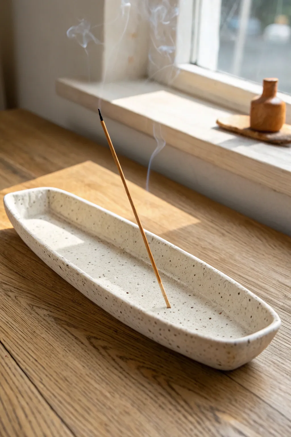 Minimal long clay incense boat tray with a tidy ash line, calm Scandi-boho styling