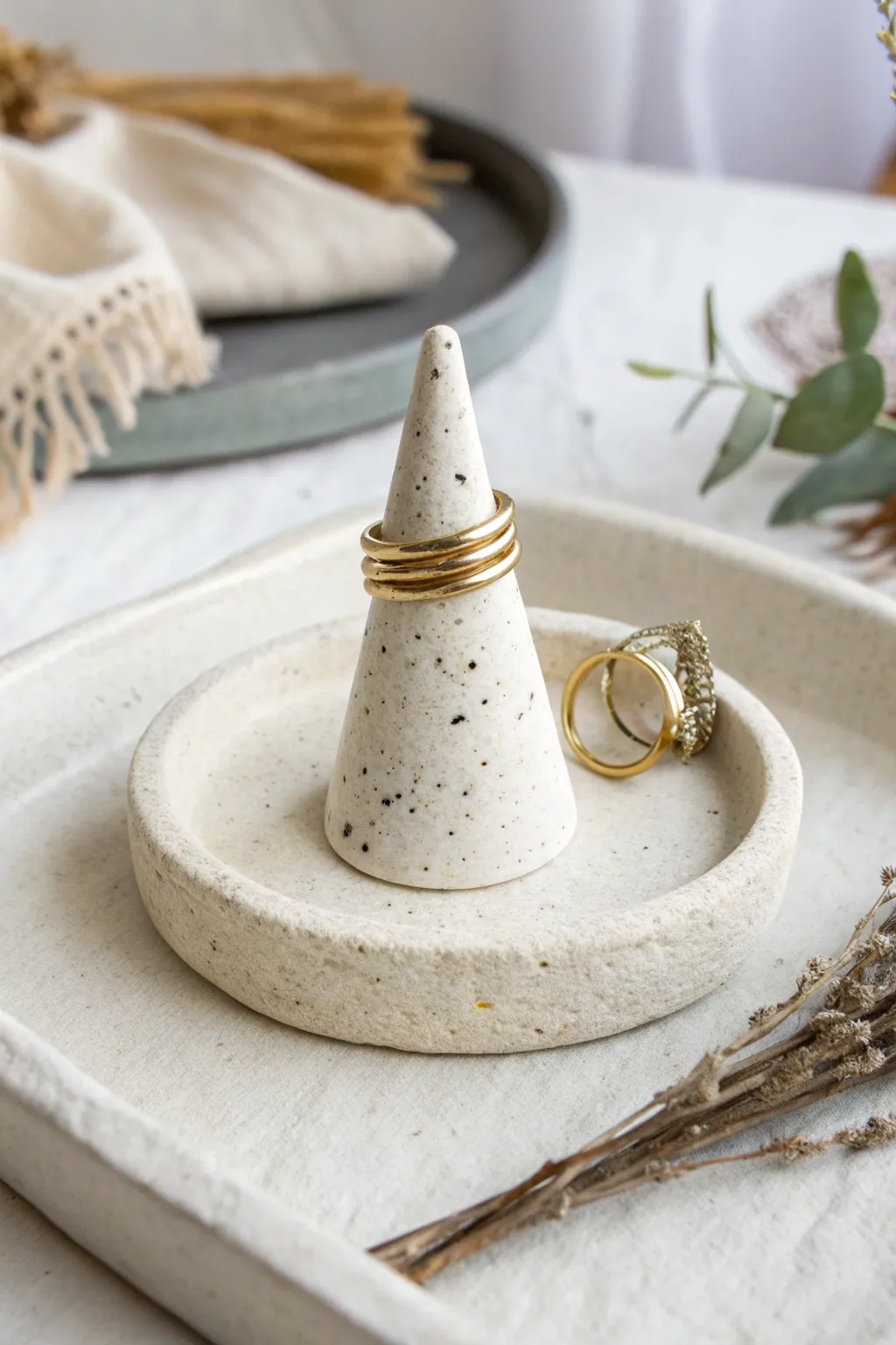 Minimal air-dry clay ring cone keeps favorites tidy by the sink, simple and handmade.