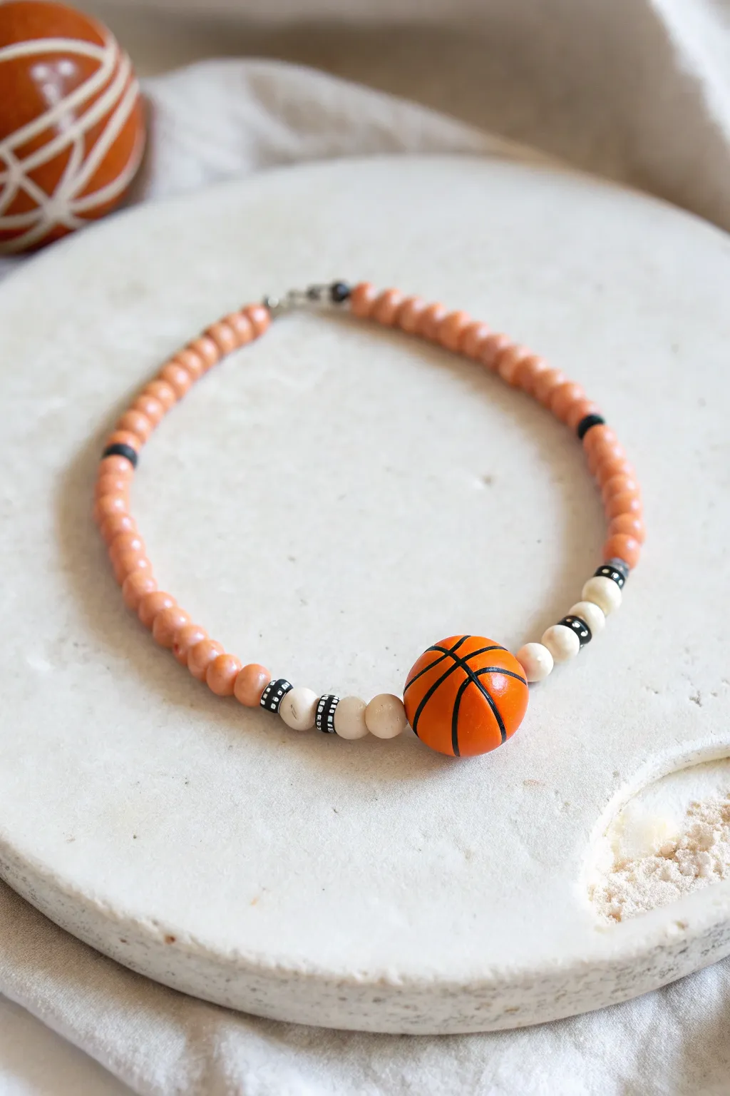 Minimalist basketball clay bead bracelet with a single focal bead and warm boho neutrals