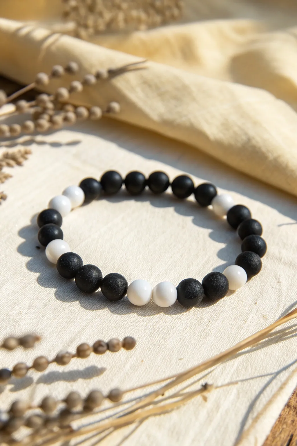 Simple alternating black and white clay beads for a clean salt-and-pepper bracelet look