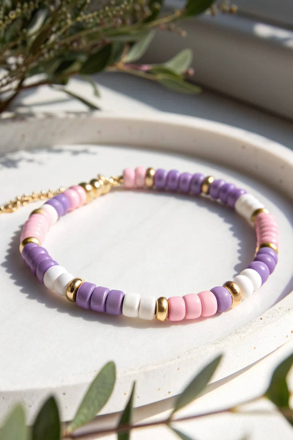 Preppy color block clay bracelet in pink, purple, and white with dainty gold spacers