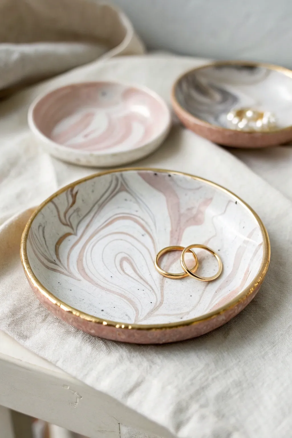 Marbled trinket dish with metallic edge, a simple handmade piece perfect to sell online