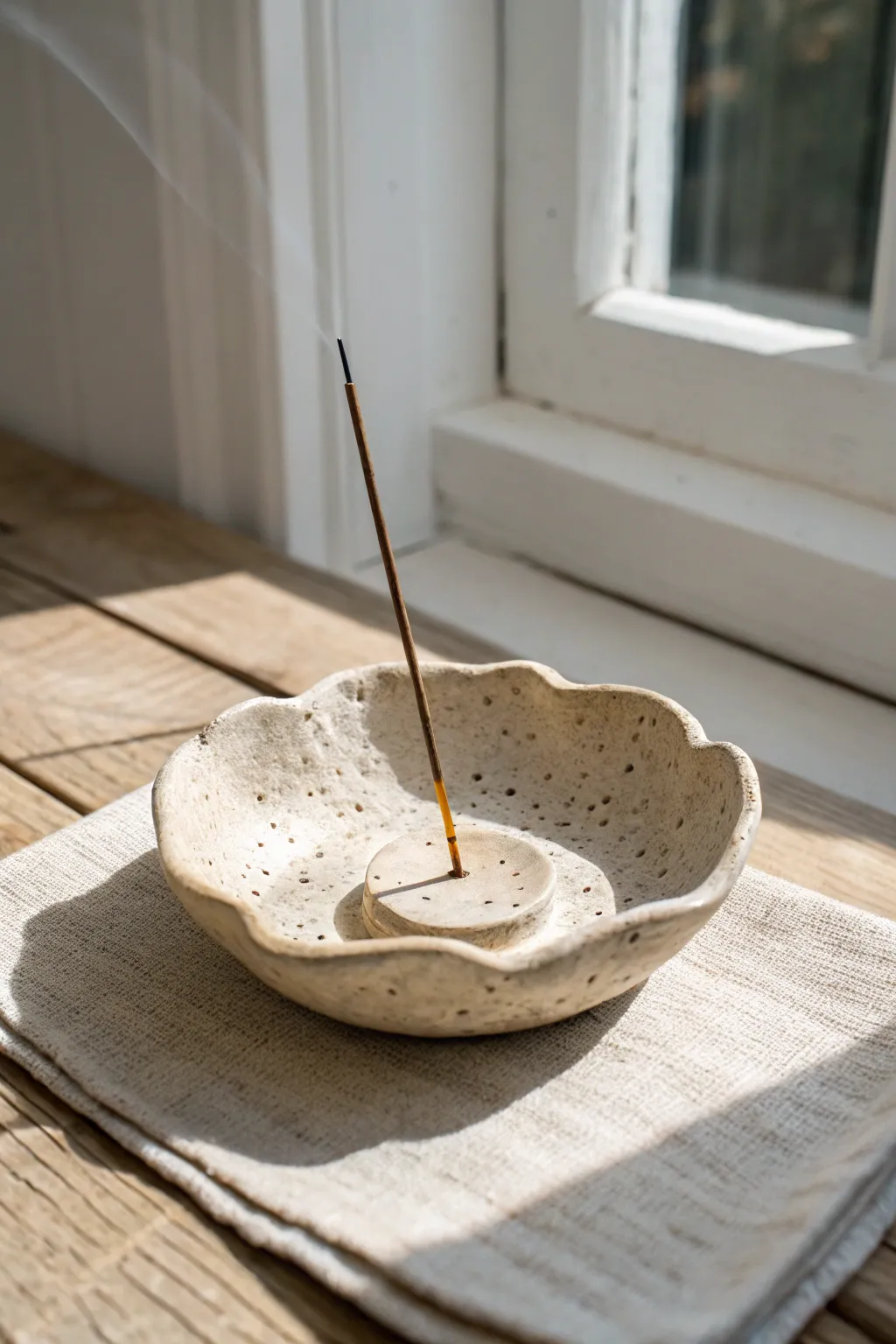 Organic pinch-dish incense holder with a wavy rim, simple, earthy, and perfectly imperfect.