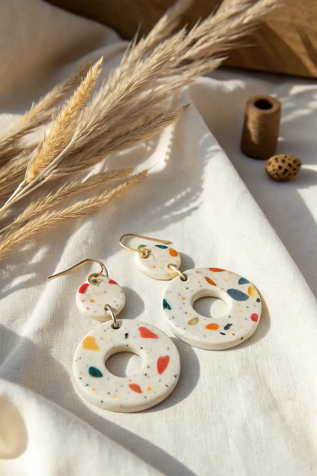 Terrazzo speckle statement drops with a clean minimalist vibe and soft boho studio styling