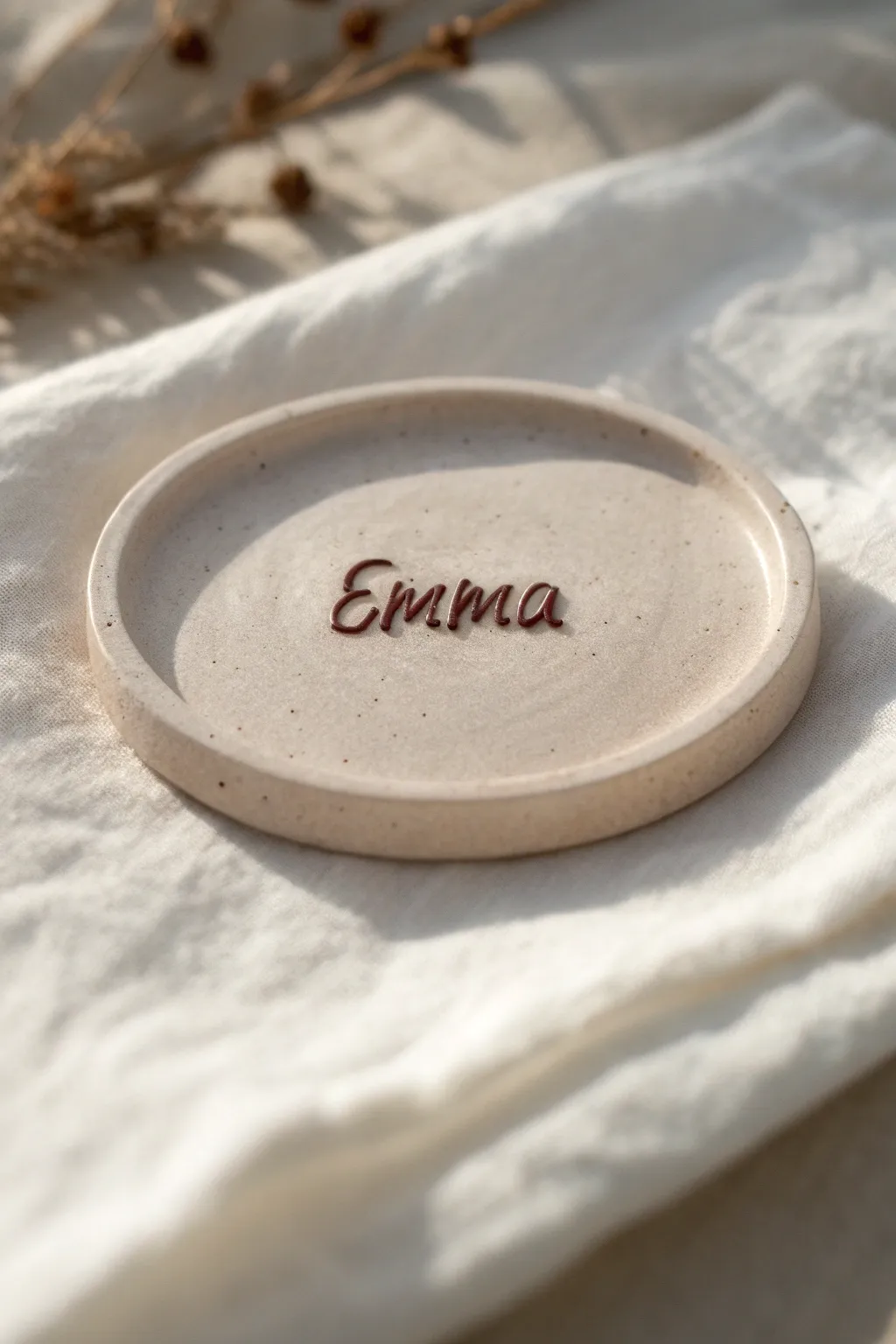 Elegant clay name plate with raised script, Scandinavian neutrals, and crisp contrast for easy reading.
