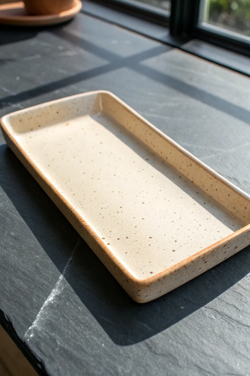 Sleek rectangular clay rolling tray with crisp corners and a clean, minimalist Scandinavian look