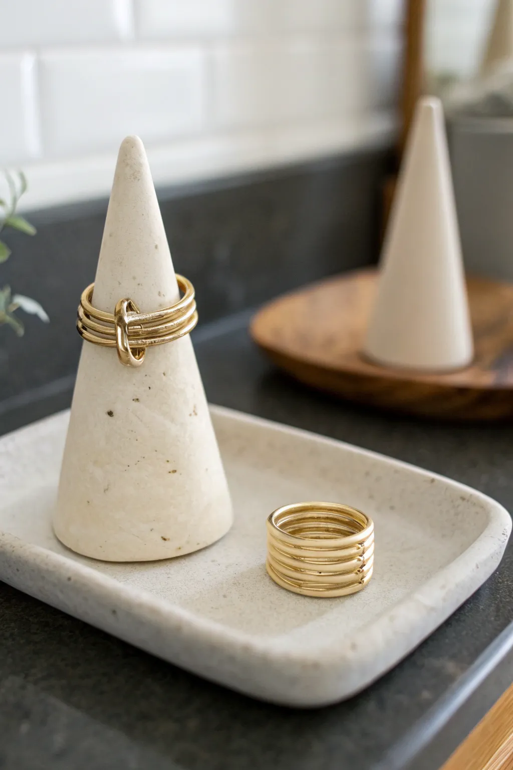 Minimal clay ring cone on a vanity, Scandinavian calm with a soft boho touch and clean contrast.