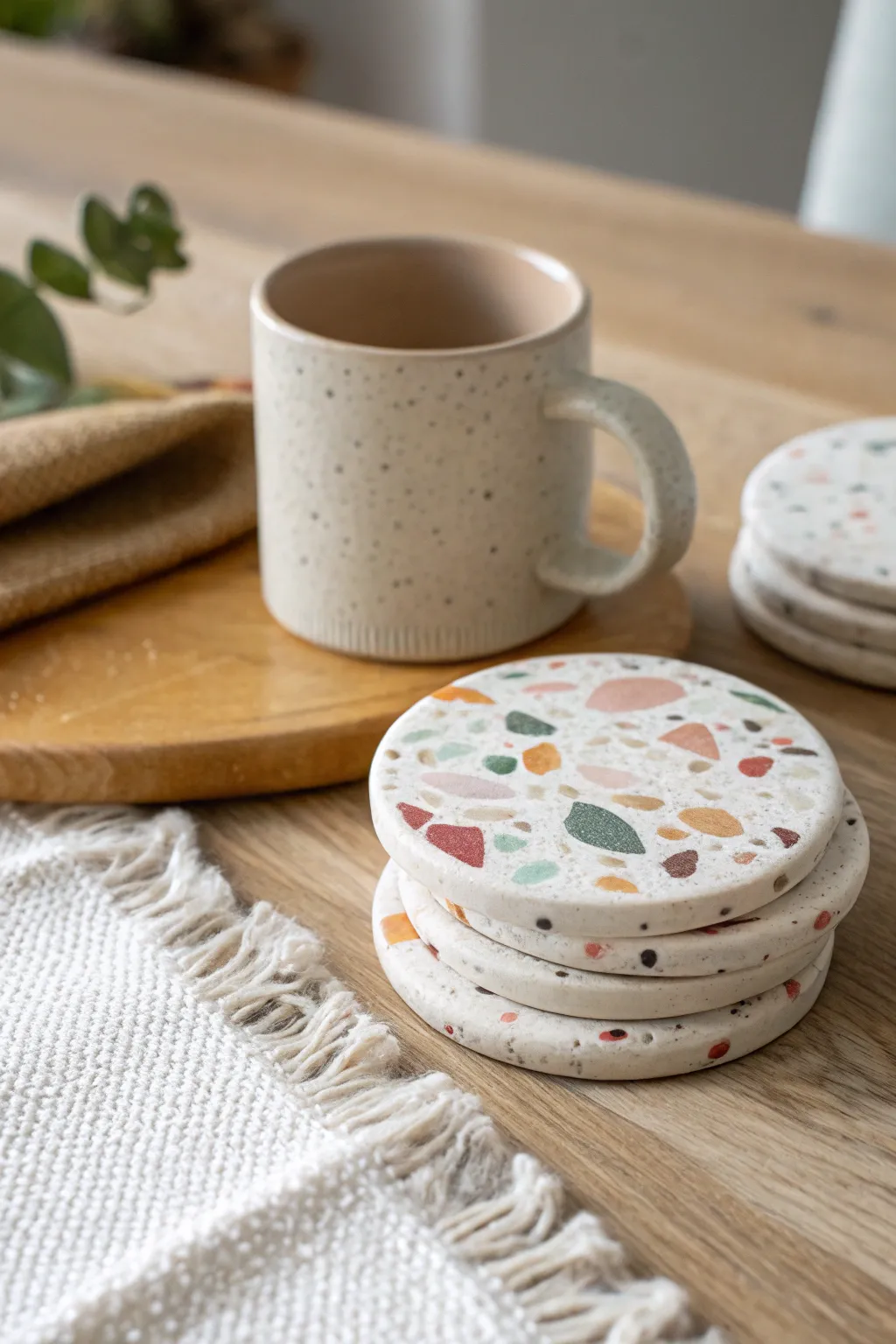Terrazzo air dry clay coasters add a playful pop to your minimalist coffee table vibe.