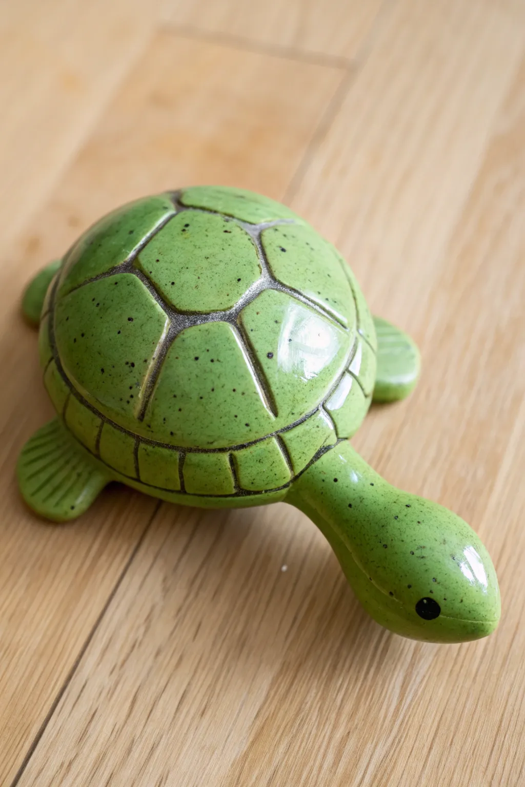 Classic turtle shell clay rattle in fresh green, minimalist and sweet with a handmade touch