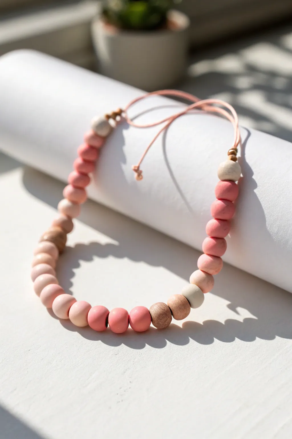 Blush-to-rose ombré clay disc bracelet, clean minimal styling with soft boho charm