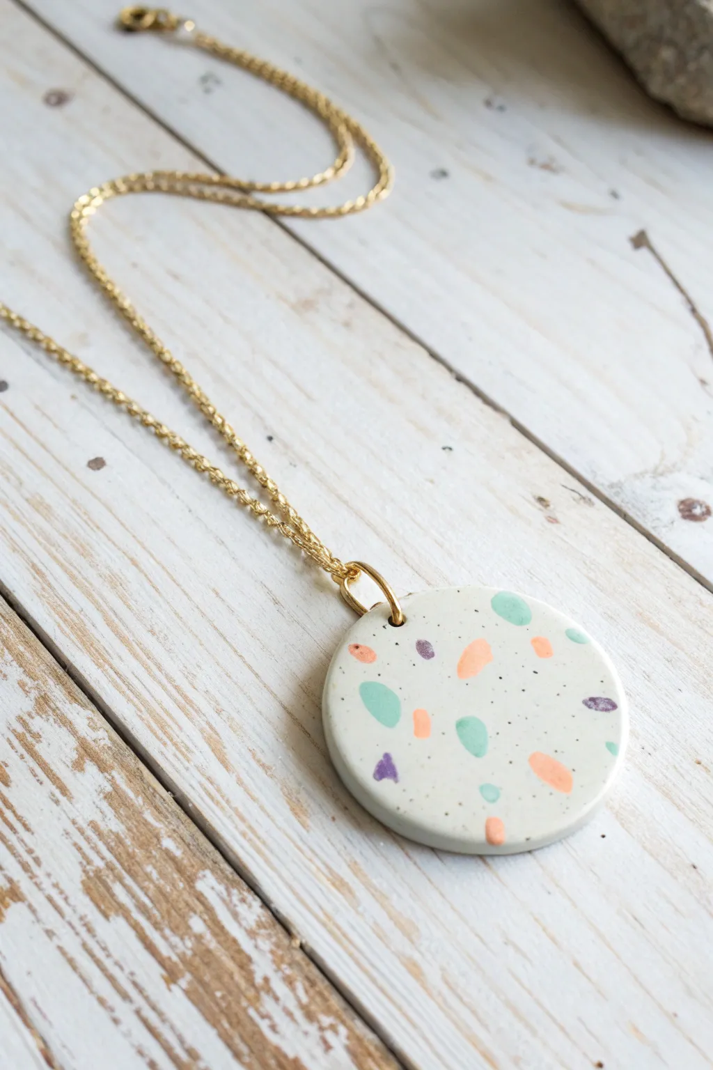 Pastel terrazzo dot disc pendant on a simple chain, a sweet minimalist polymer clay necklace idea.