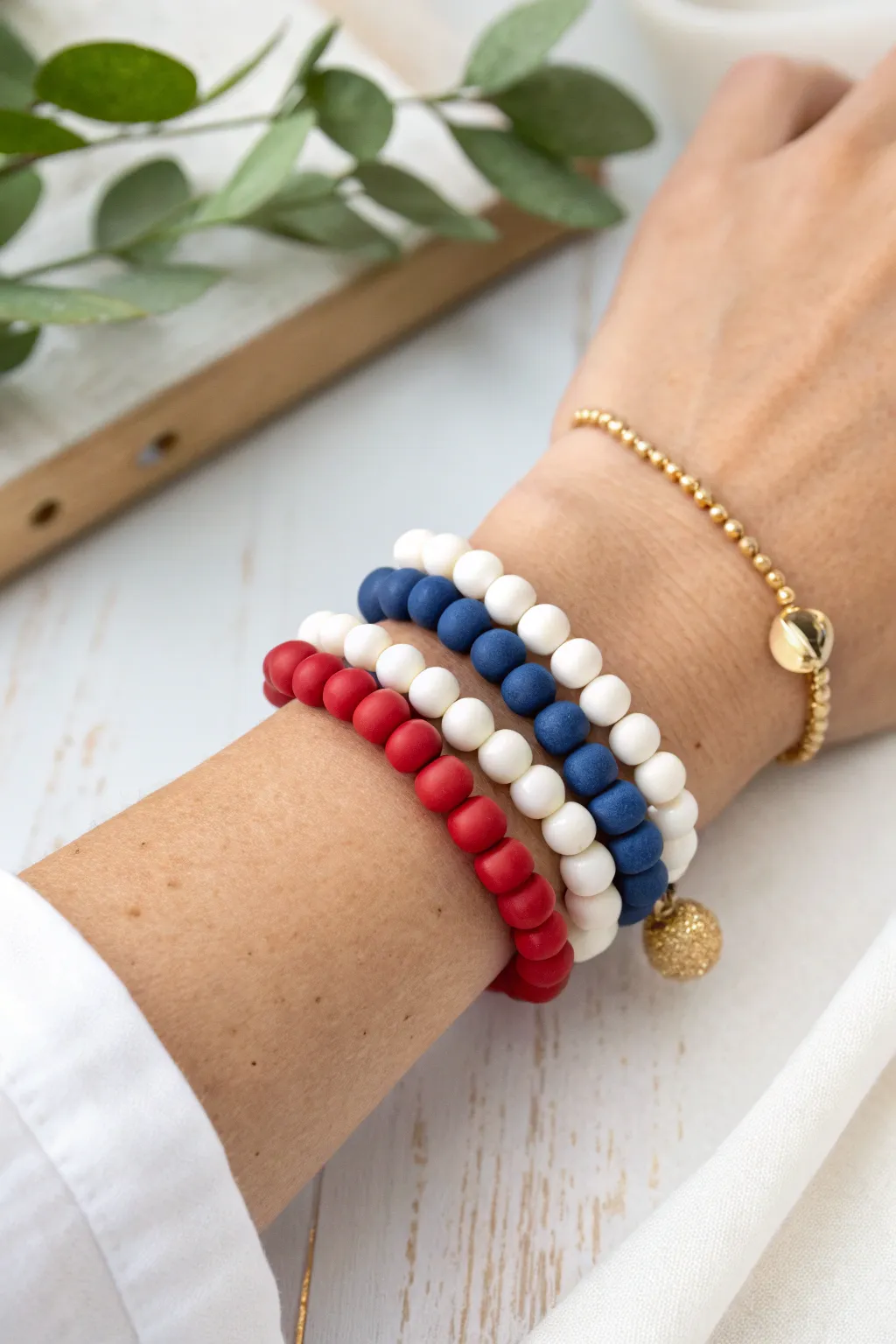 Simple red, white, and blue clay bead trio stack for an effortlessly festive Fourth of July look.