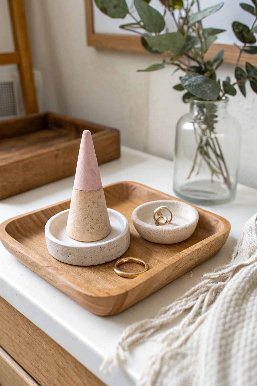 Soft neutral handmade clay ring cone and dish on a minimalist tray, perfect for a calm vanity.