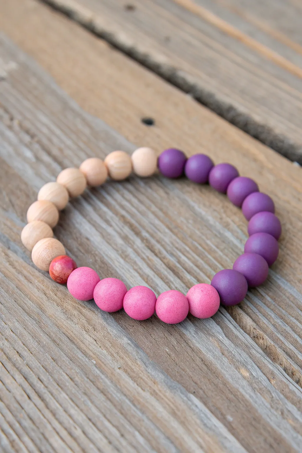 Bold pink and purple clay bead bracelet with crisp color blocking and a clean minimalist vibe.