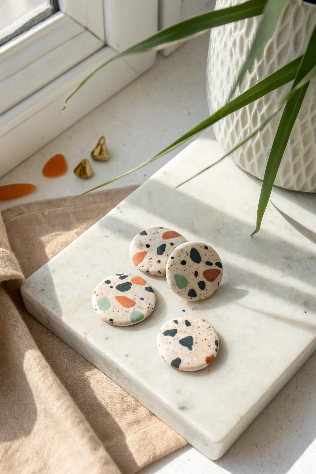 Terrazzo speckle poly clay statement studs in soft boho colors, simple to batch-make.