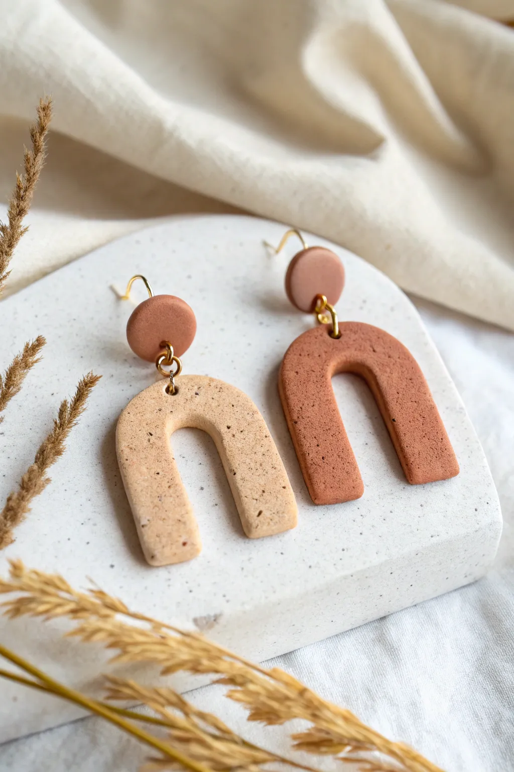 Easy arch dangle polymer clay earrings in calm neutrals, minimalist style with a soft boho feel