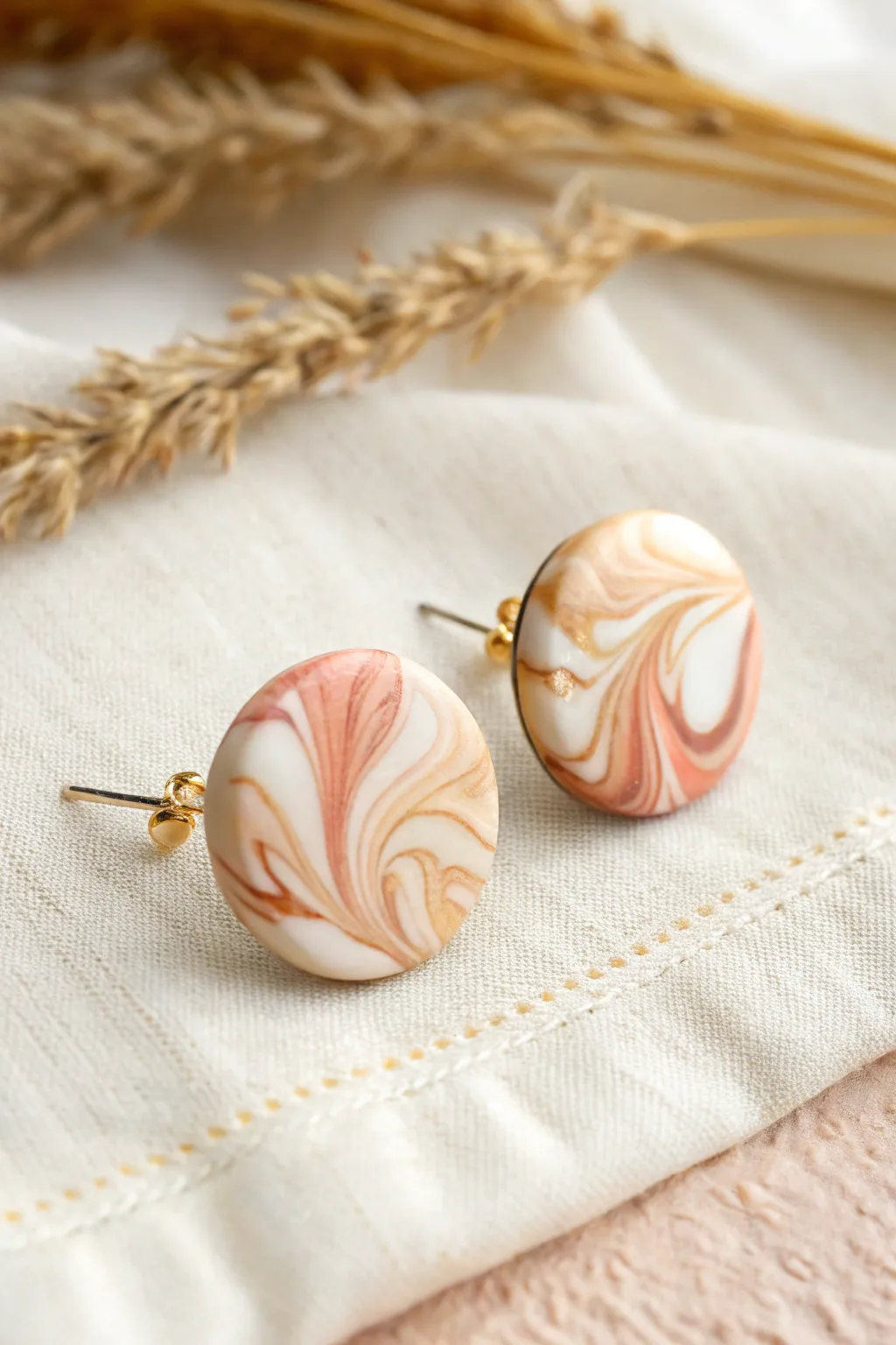 Glossy marbled round stud earrings in soft neutrals, minimalist and handmade with a boho touch.
