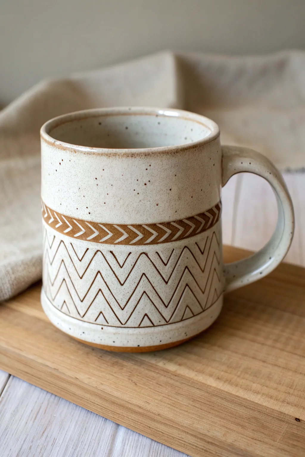 Bold carved chevrons add instant rhythm while smooth rim and foot keep it clean.