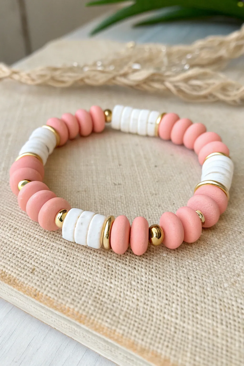 Bold blush and white clay disc beads with sleek gold spacers for a preppy color-block look