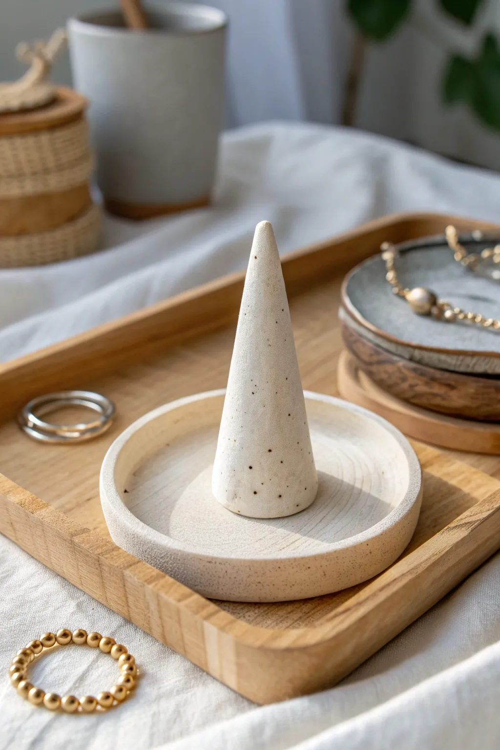 Minimal self-hardening clay ring cone holder with a matte finish, styled in soft Nordic tones