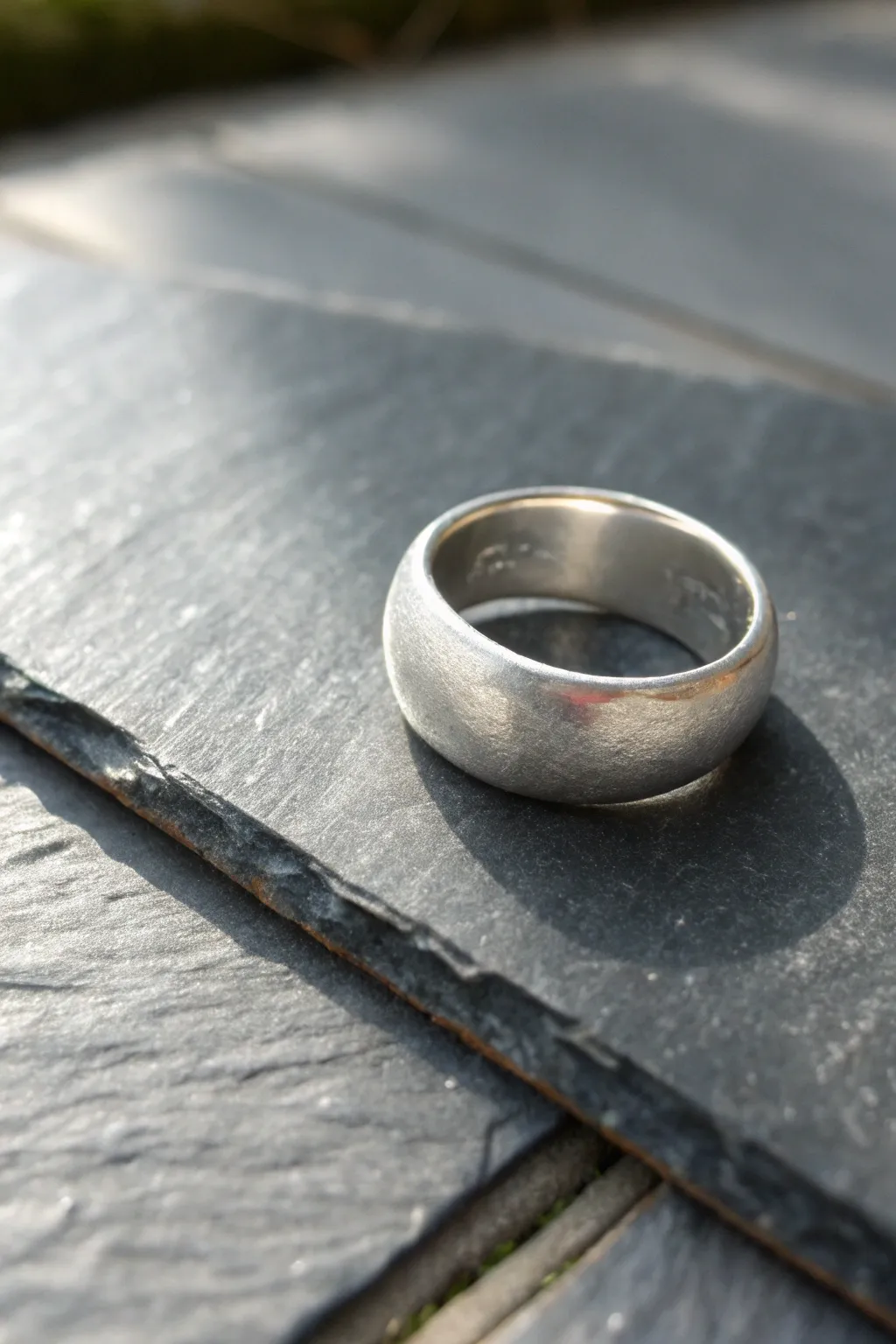 Wide comfort-fit silver clay statement band on slate, bold minimal shine for easy DIY elegance