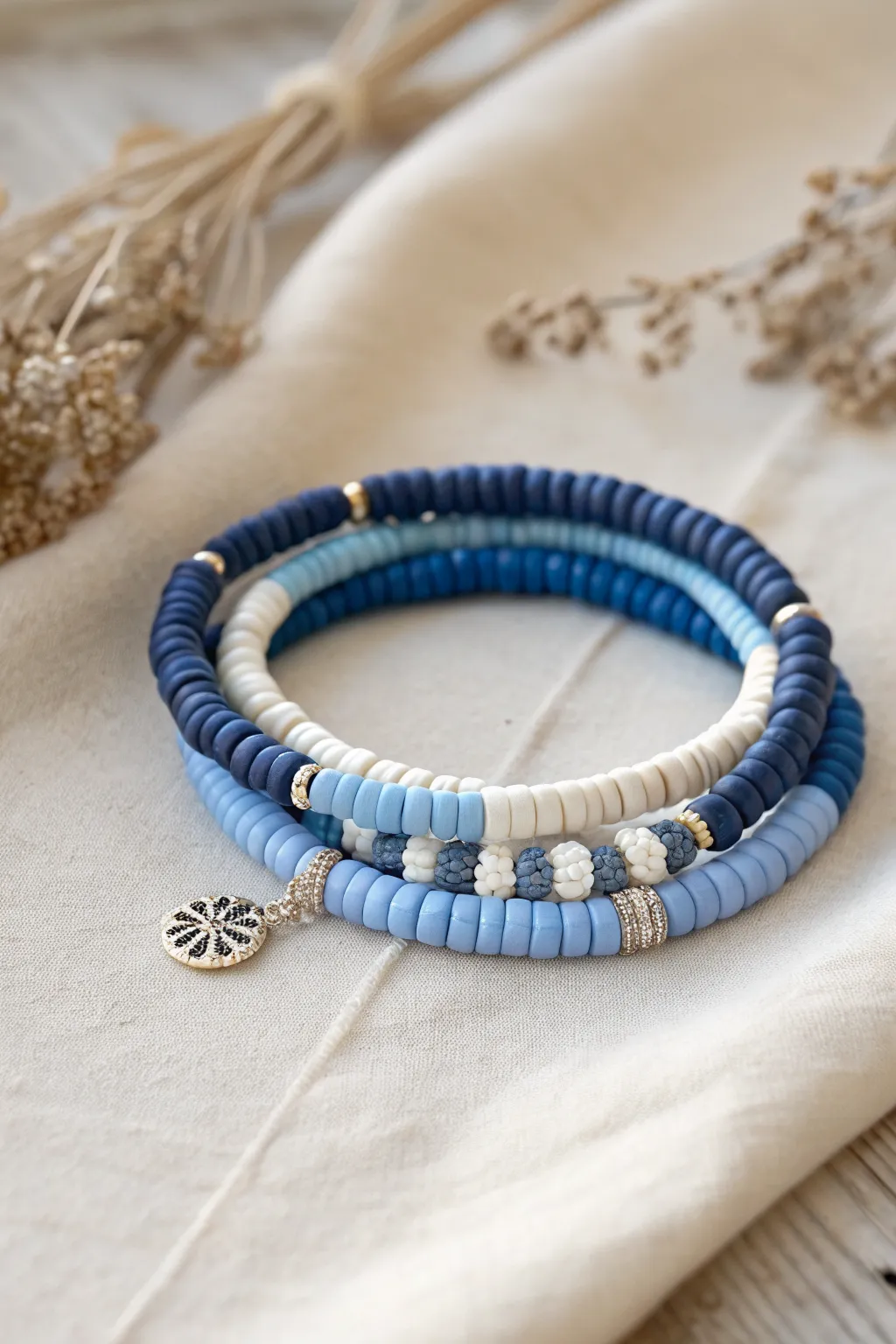 Blue ombre heishi bead stack with a tiny white cluster accent, minimal and beautifully handmade