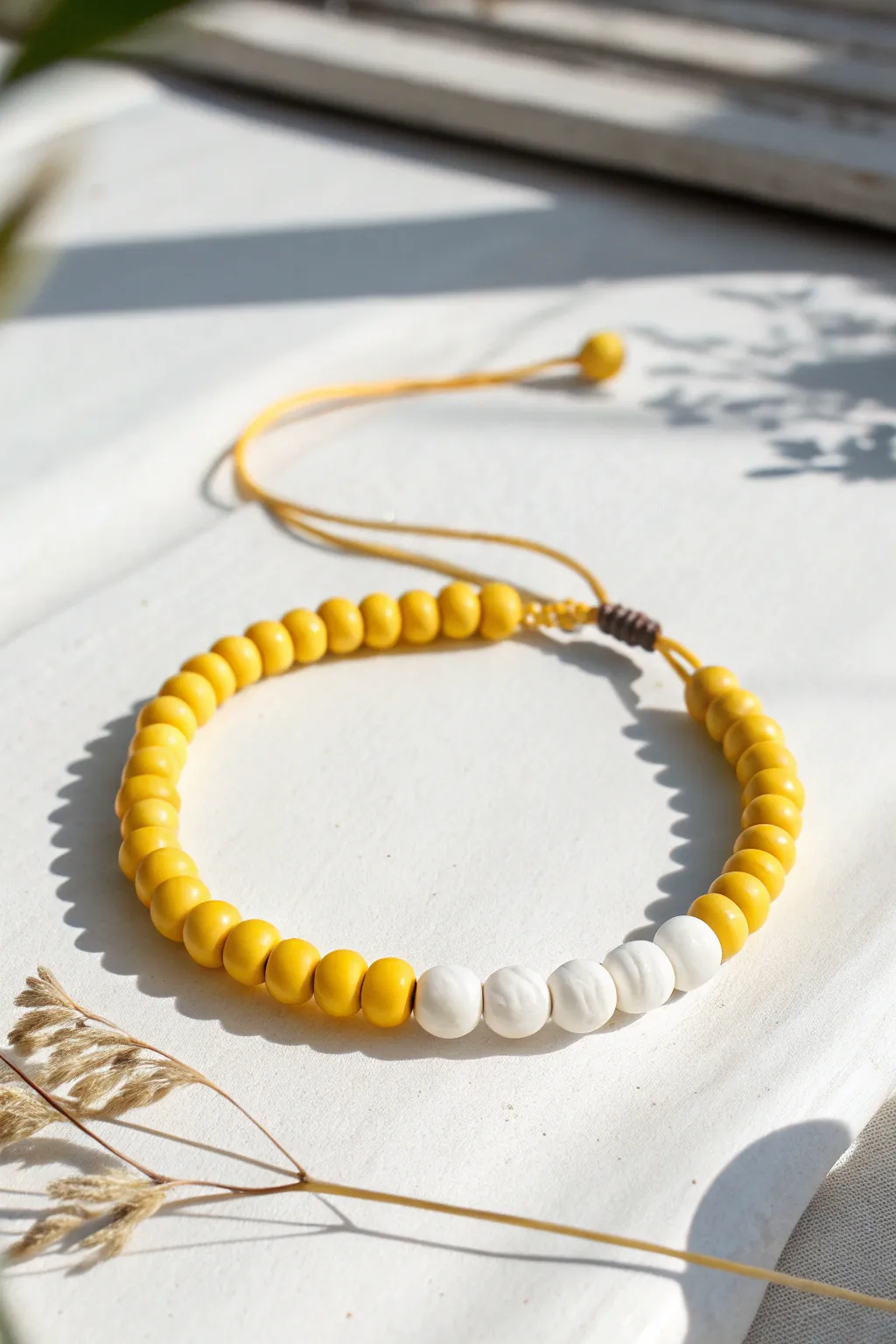 Sunny yellow and white alternating clay beads create a clean, beginner friendly bracelet pattern.