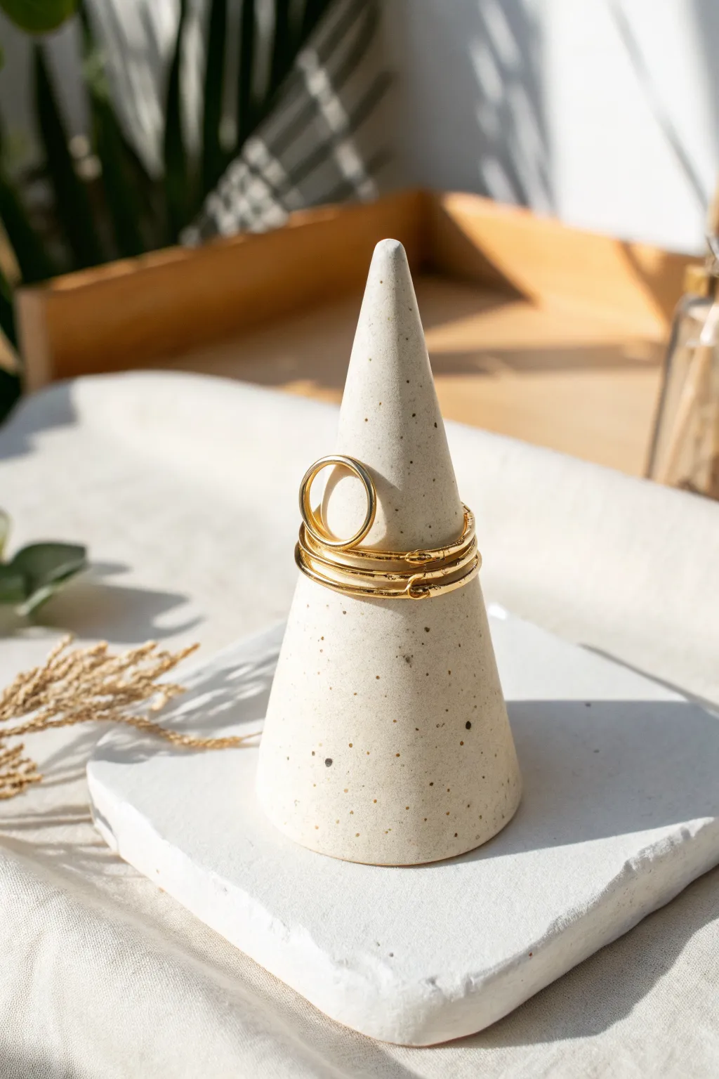 Minimal air dry clay ring cone holder with a satin finish, styled bright for a calm boho look