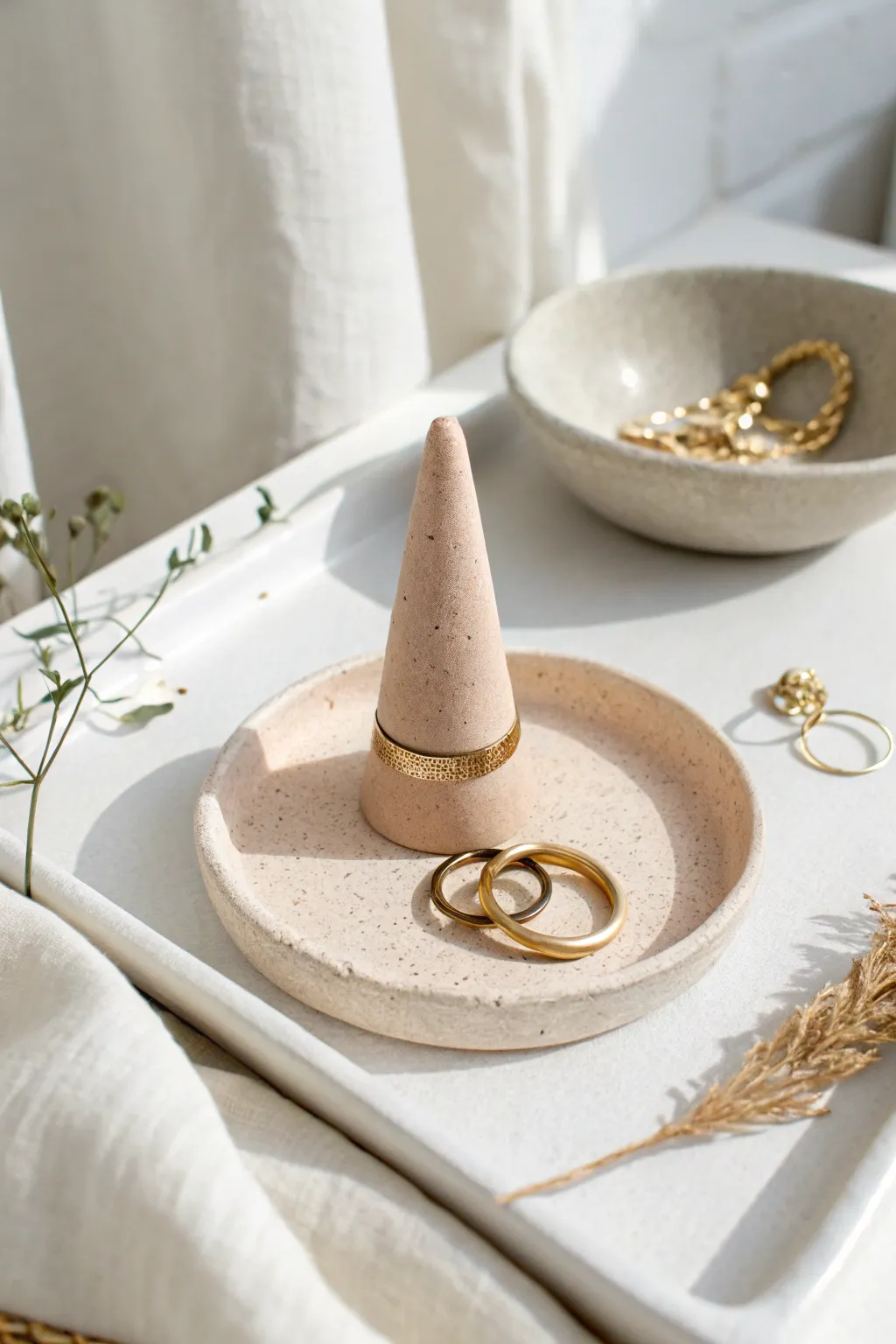 DIY air-dry clay ring cone and catch dish set in soft neutral tones, clean minimalist styling