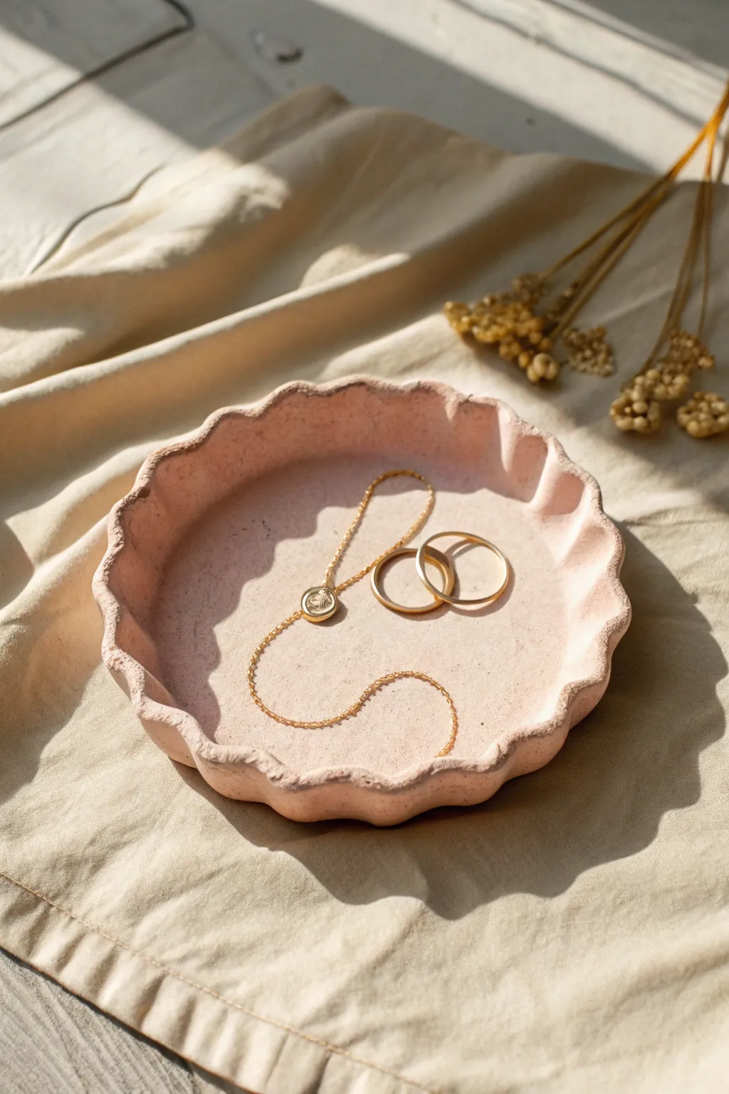 Pastel scalloped air dry clay tray styled with delicate necklaces and rings, minimal and romantic