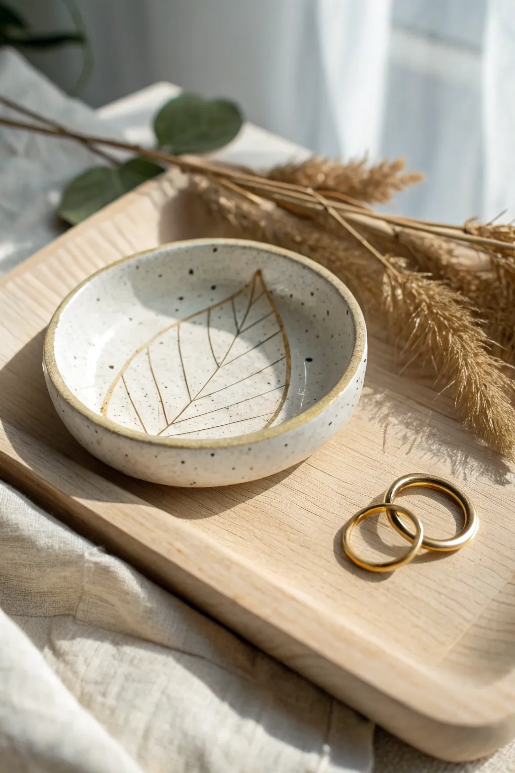 Pressed-leaf ring dish: a simple clay project that adds Scandinavian calm to your bedside.