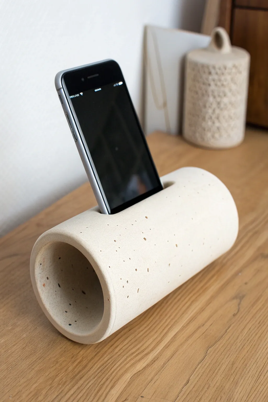 Minimal ceramic tube dock that amplifies sound naturally, calm Scandi style with soft boho warmth