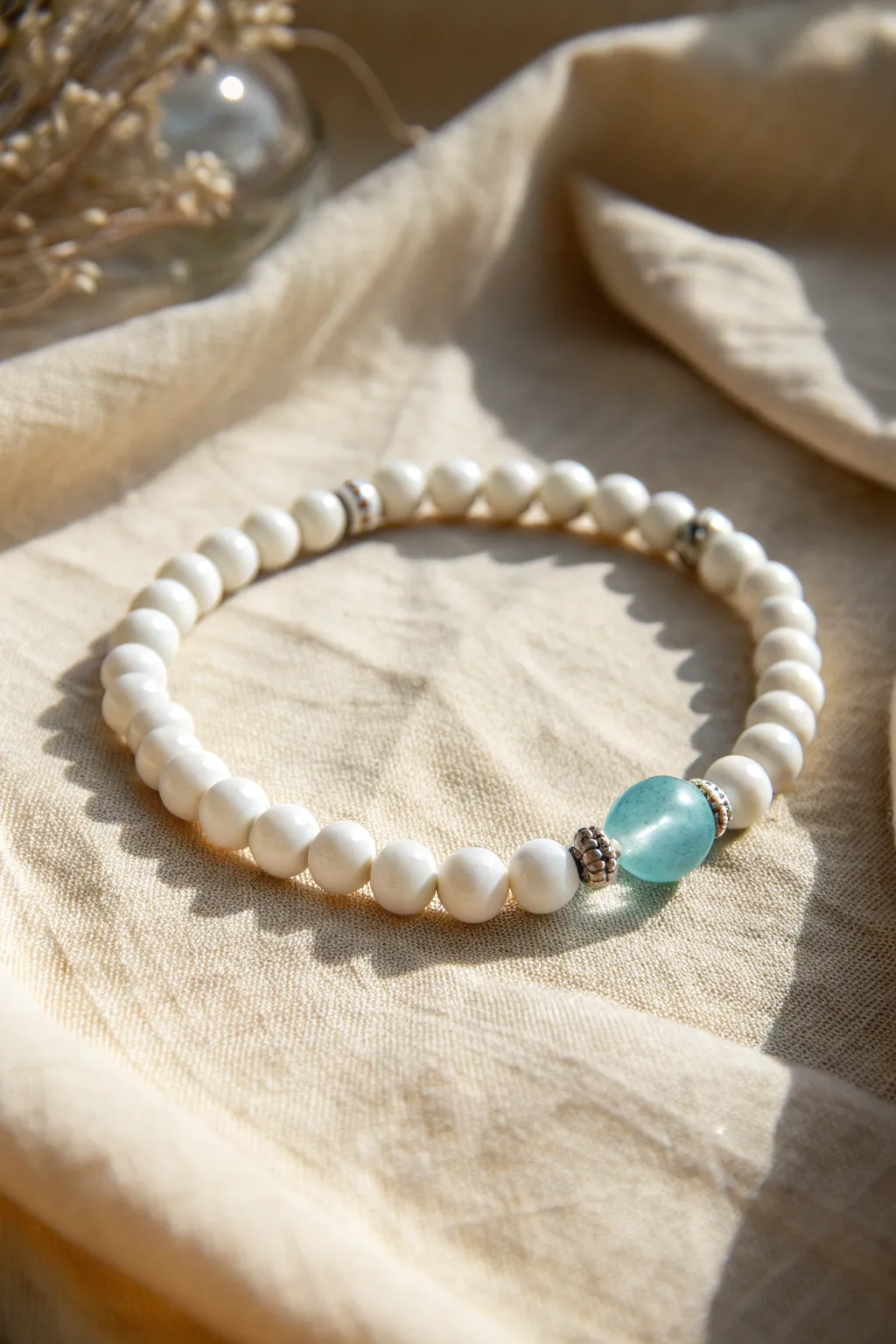 All-white clay bead bracelet with one bold accent bead for an easy, minimalist aesthetic