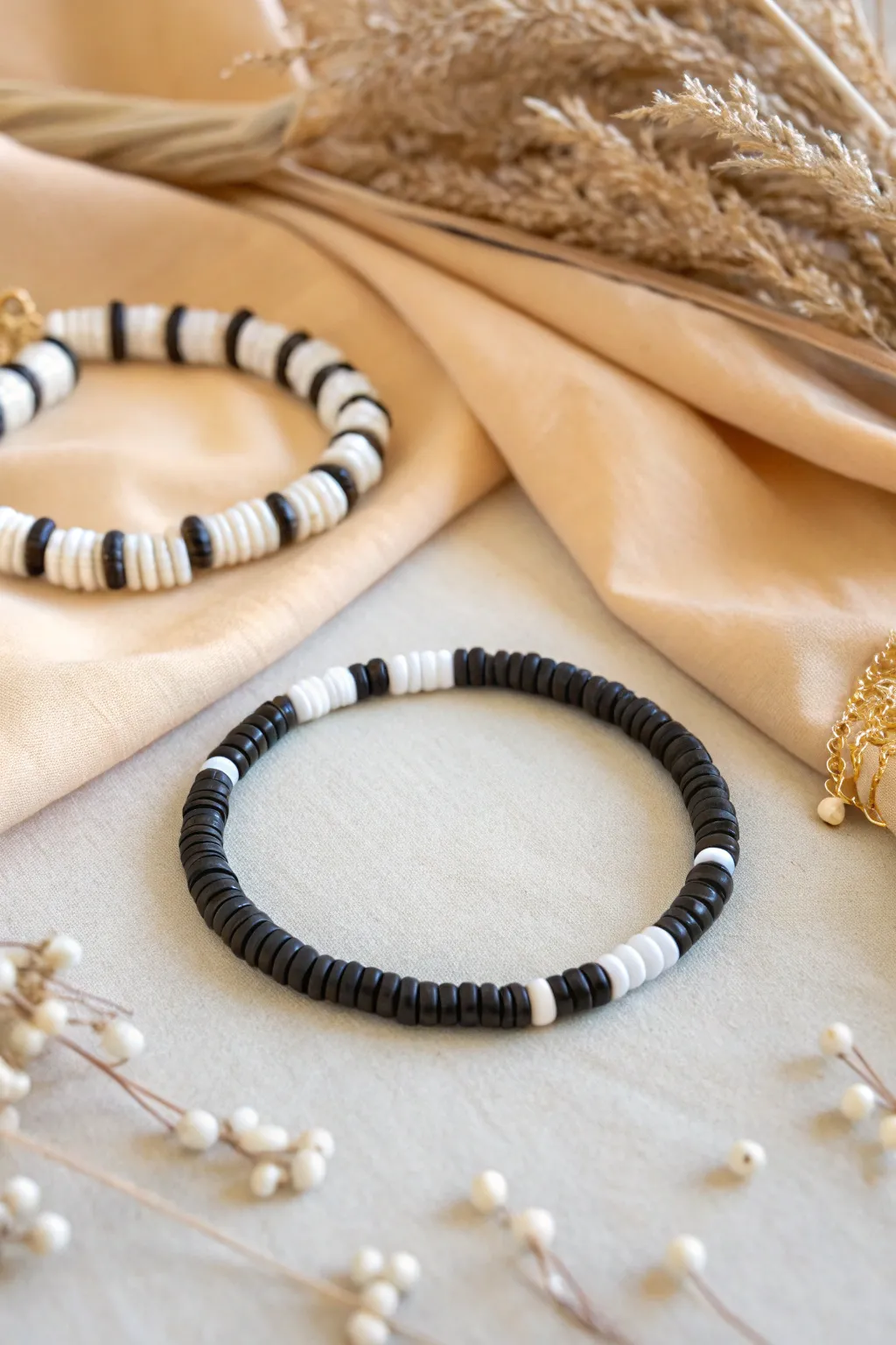 Crisp black and white heishi bead bracelets in a clean minimal mix, modern and easy to copy.