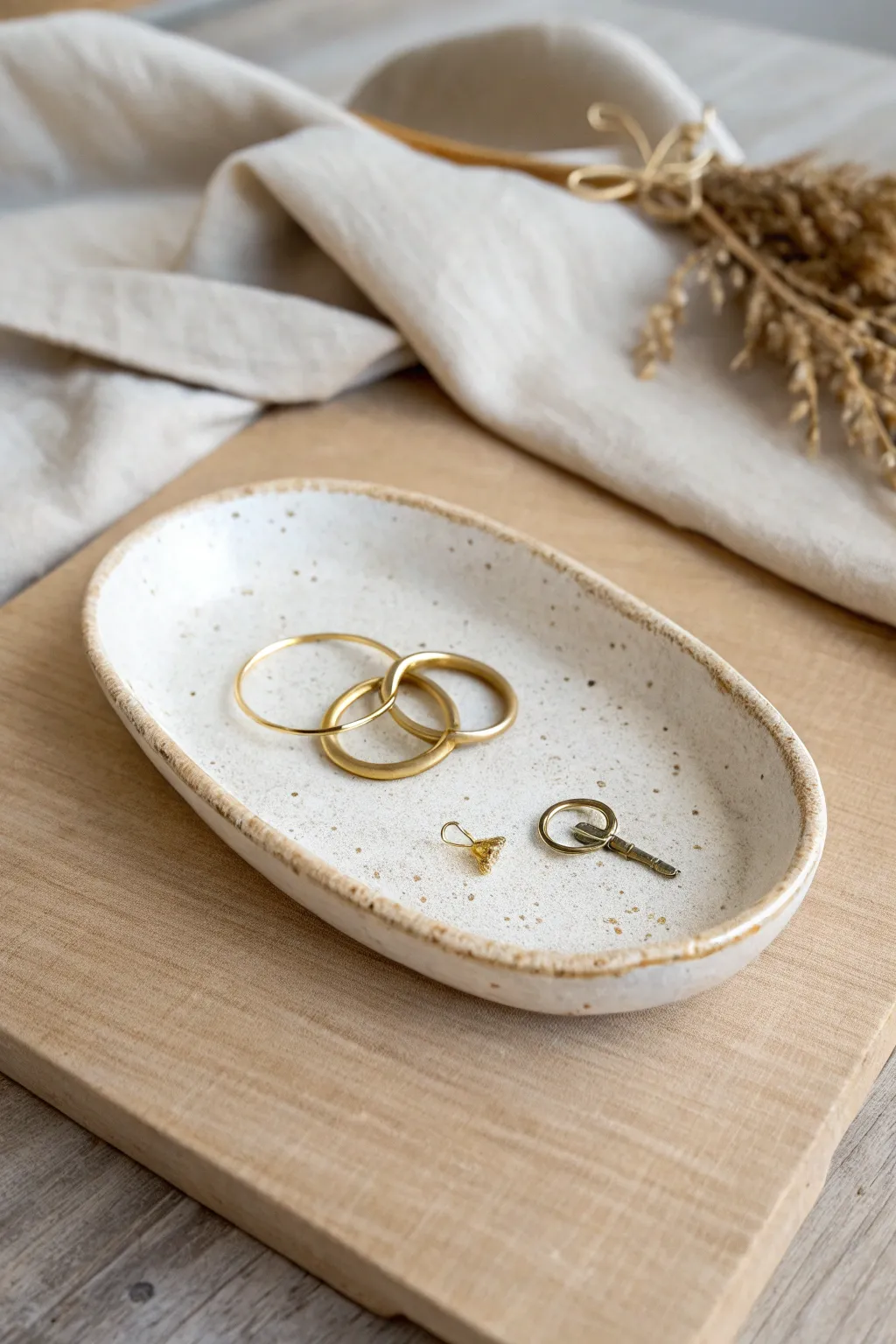 Simple slab-built trinket tray with lifted corners, styled for rings and everyday essentials.