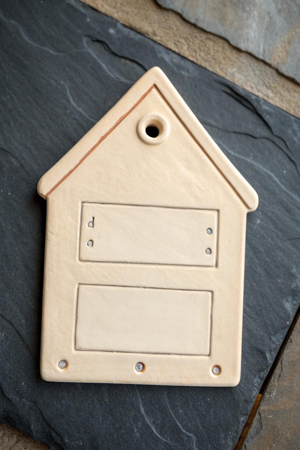 House-shaped clay door name plate with matte finish and clean minimalist lines, easy and elegant