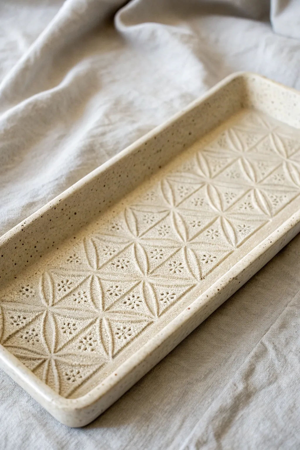 Crisp stencil-embossed slab texture turns a simple tray into a minimalist statement piece.