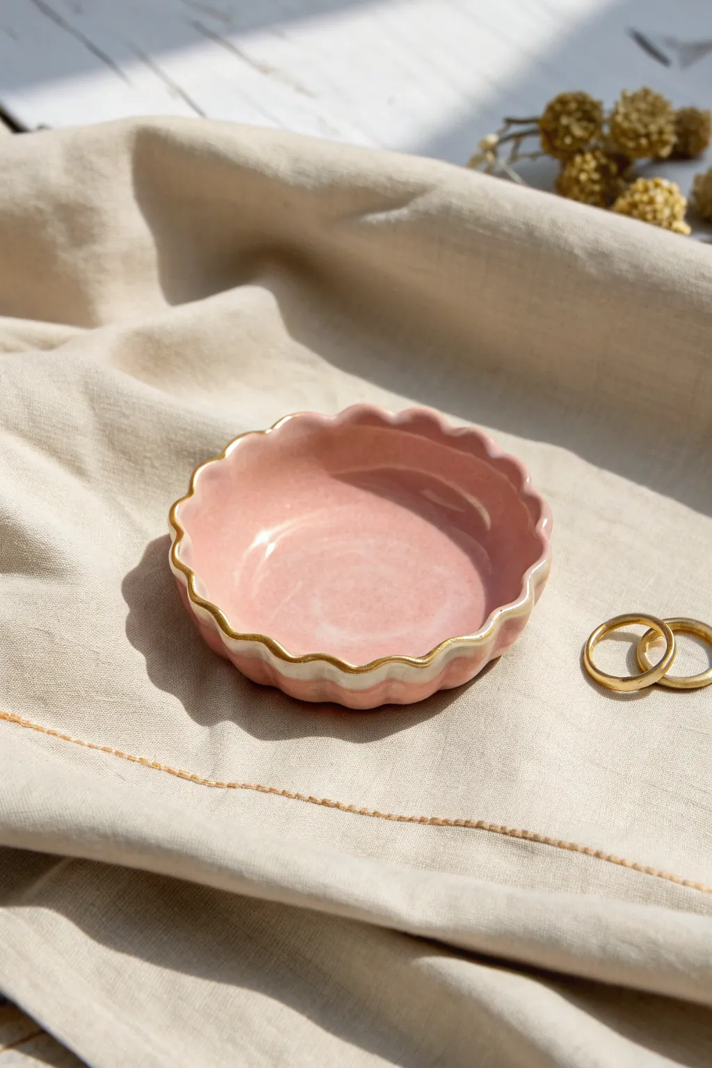 Soft pastel scalloped clay tray on gingham, glossy finish with stacked rings for scale
