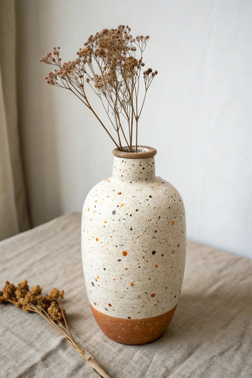 Minimal speckled terrazzo vase in soft earthy tones for a calm Scandinavian boho look