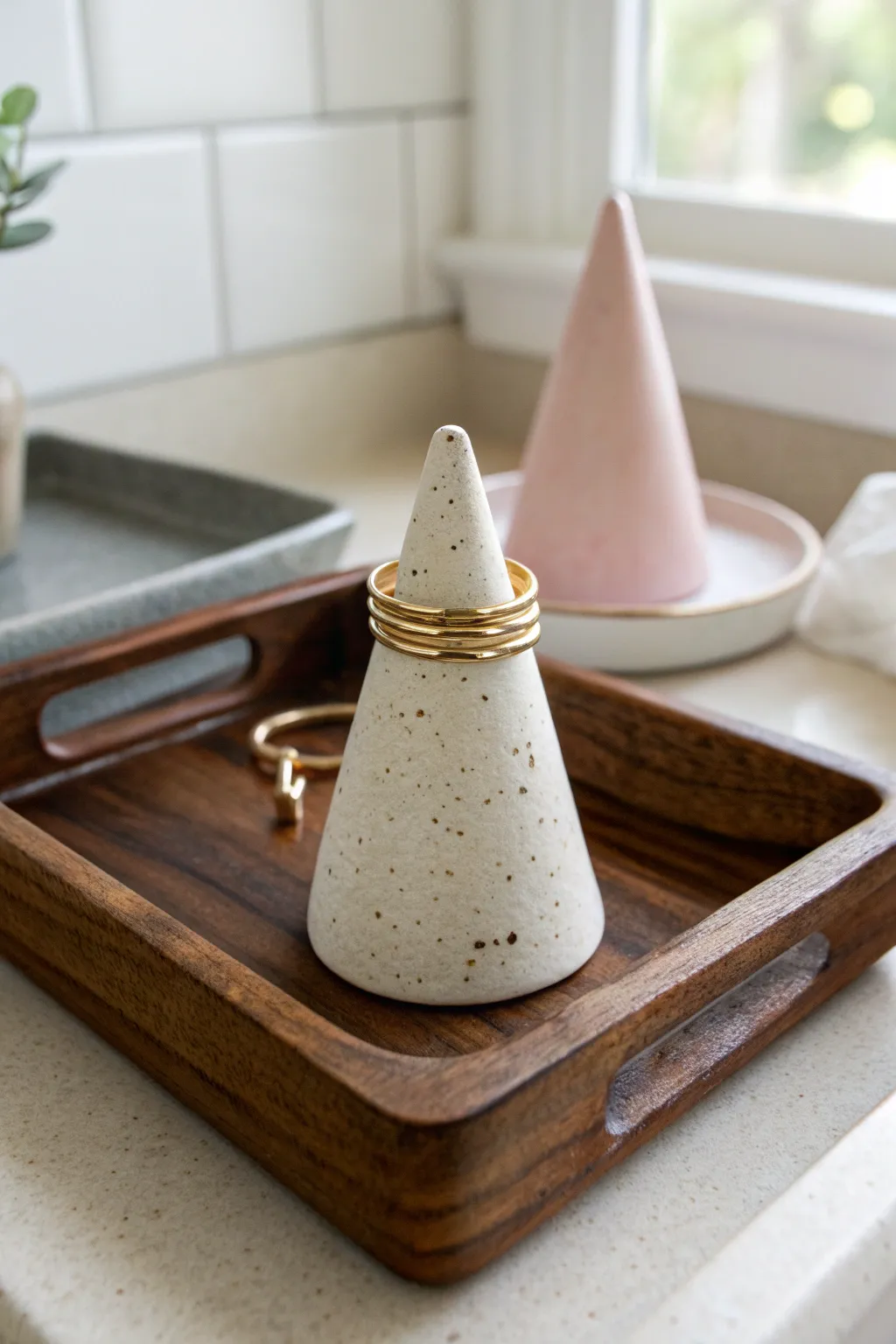 Minimalist clay ring holder cone with delicate rings, perfect modern DIY pottery inspiration