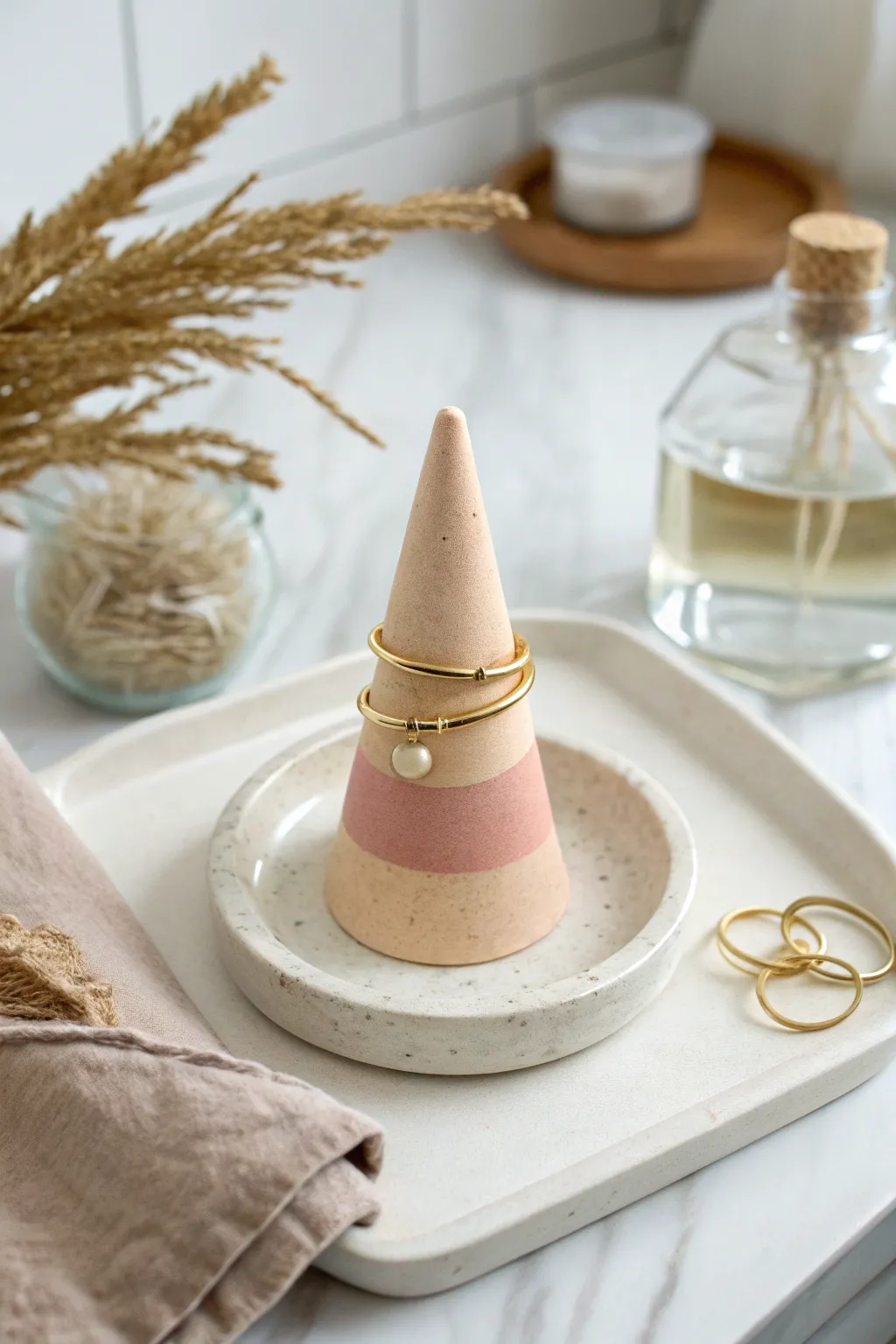 Muted pastel air dry clay ring cone for a vanity, minimalist storage with a soft boho feel