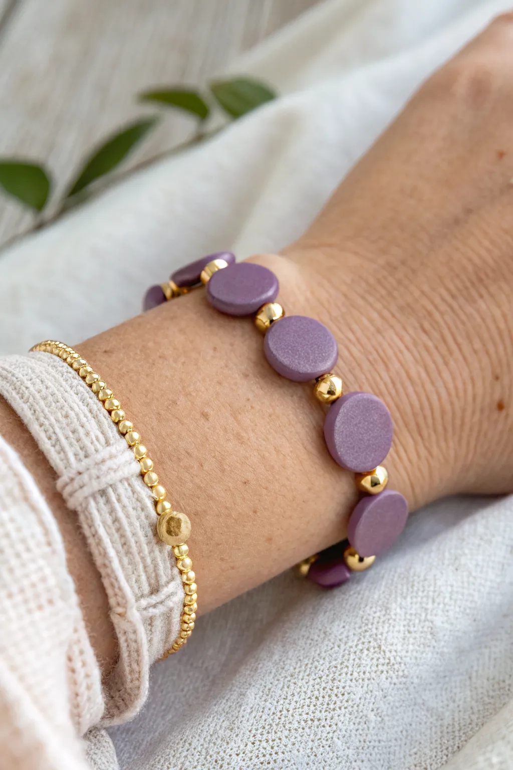 Medium purple clay beads with warm gold spacers for an effortless minimalist boho look.