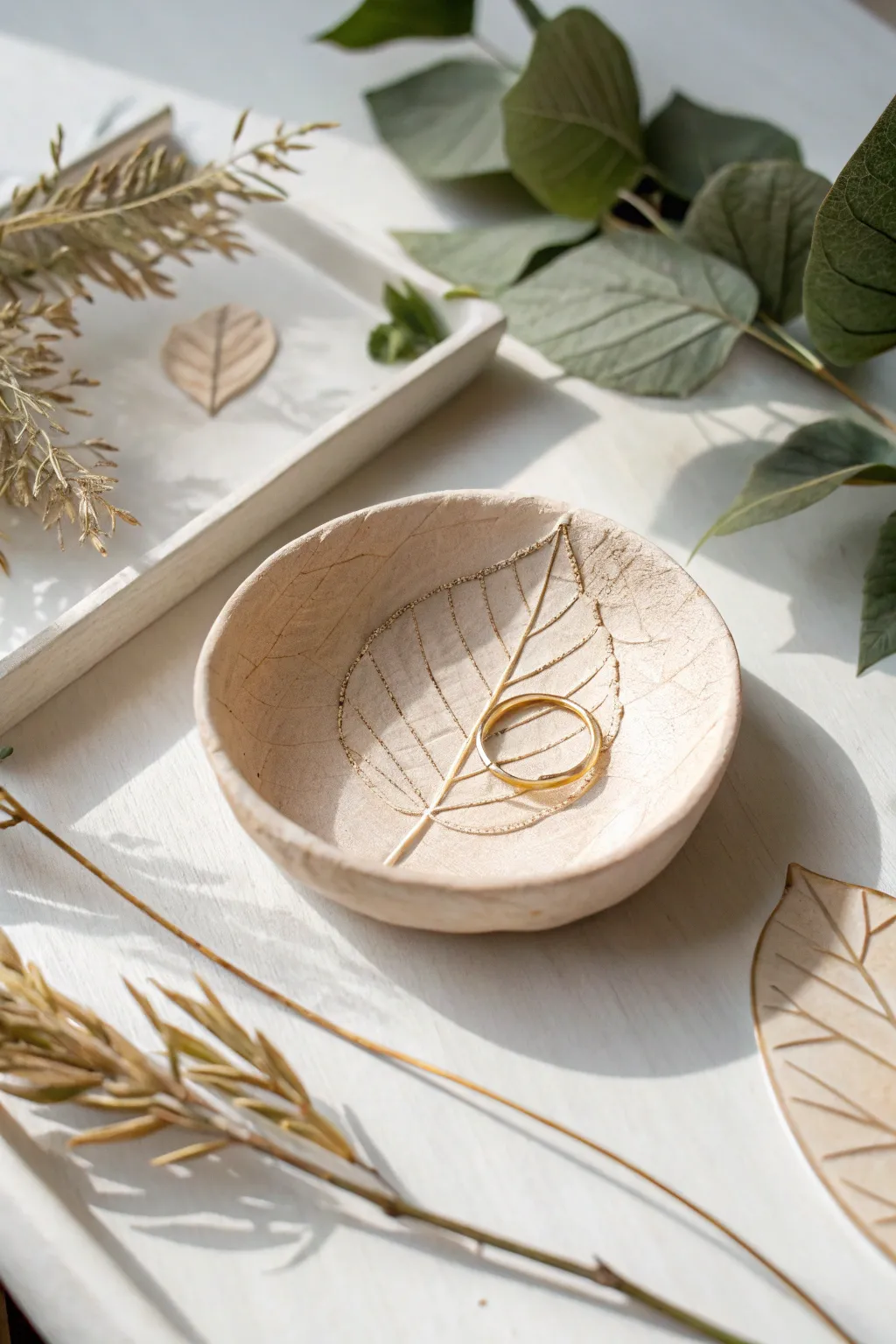 Leaf-imprint air dry clay ring dish in soft neutrals, a simple beginner project with a luxe finish.