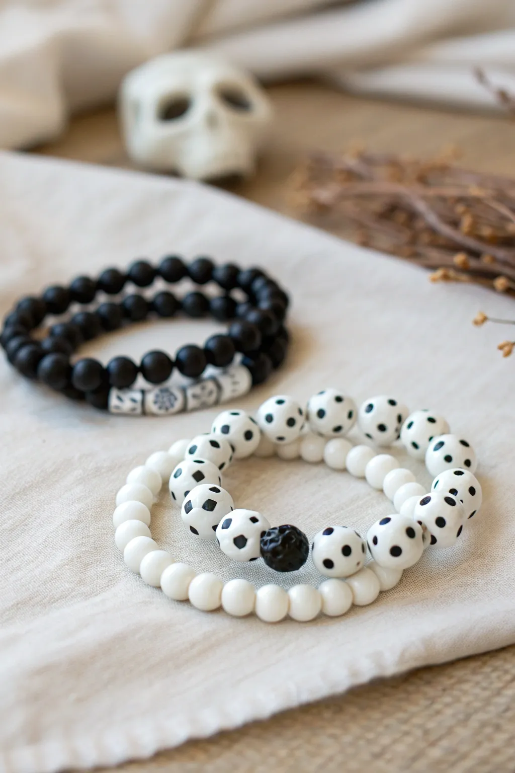 Ghostly white and black clay bracelet stack, minimalist Halloween vibes with a soft boho feel