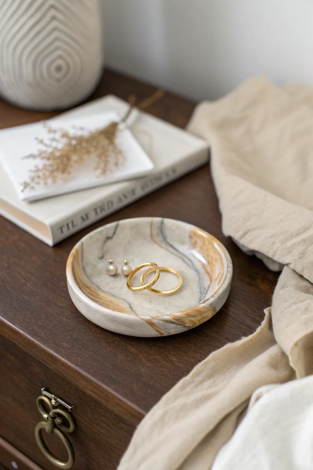 Soft stone-marbled polymer clay ring dish, a calm nightstand spot for everyday jewelry.