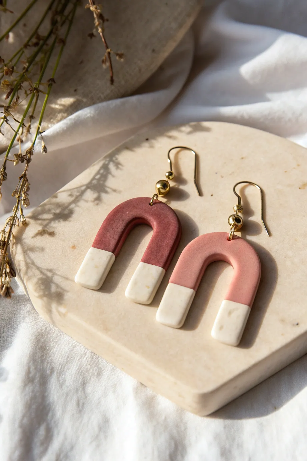 Soft ombre arch earrings in blush-to-ivory clay, minimalist yet boho and handmade.