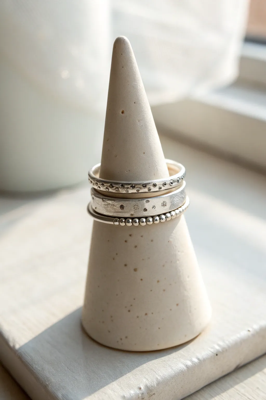 Stacked silver clay thin bands with subtle textures for an effortless handmade minimalist look.