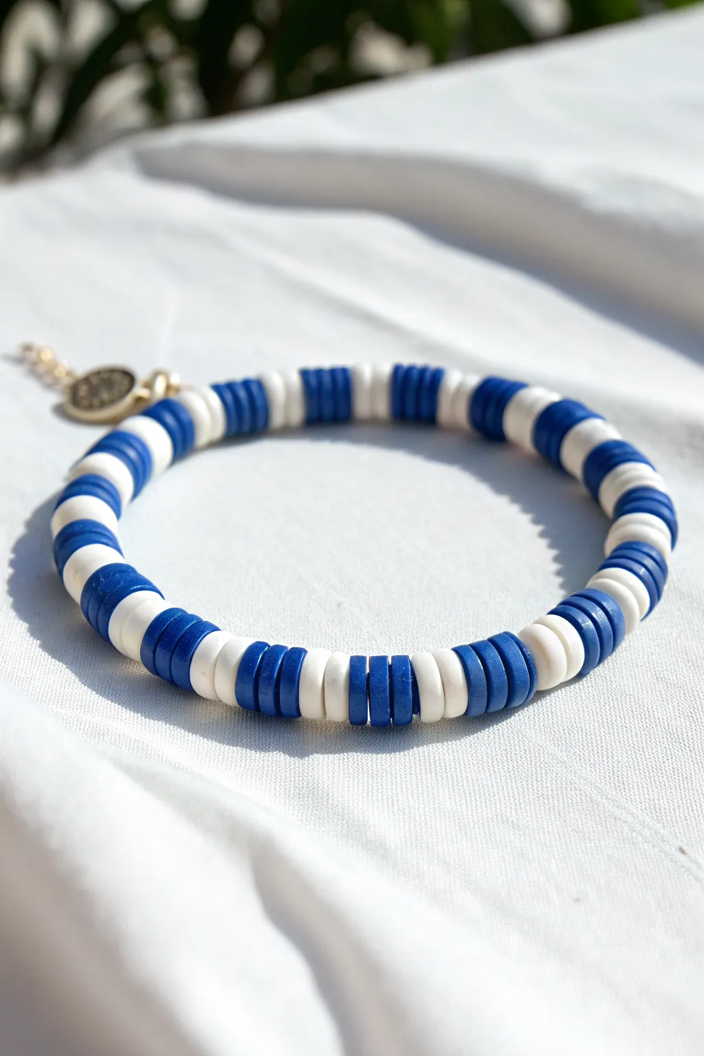 Minimal royal blue and white stitch stripe clay bead bracelet, crisp and timeless.
