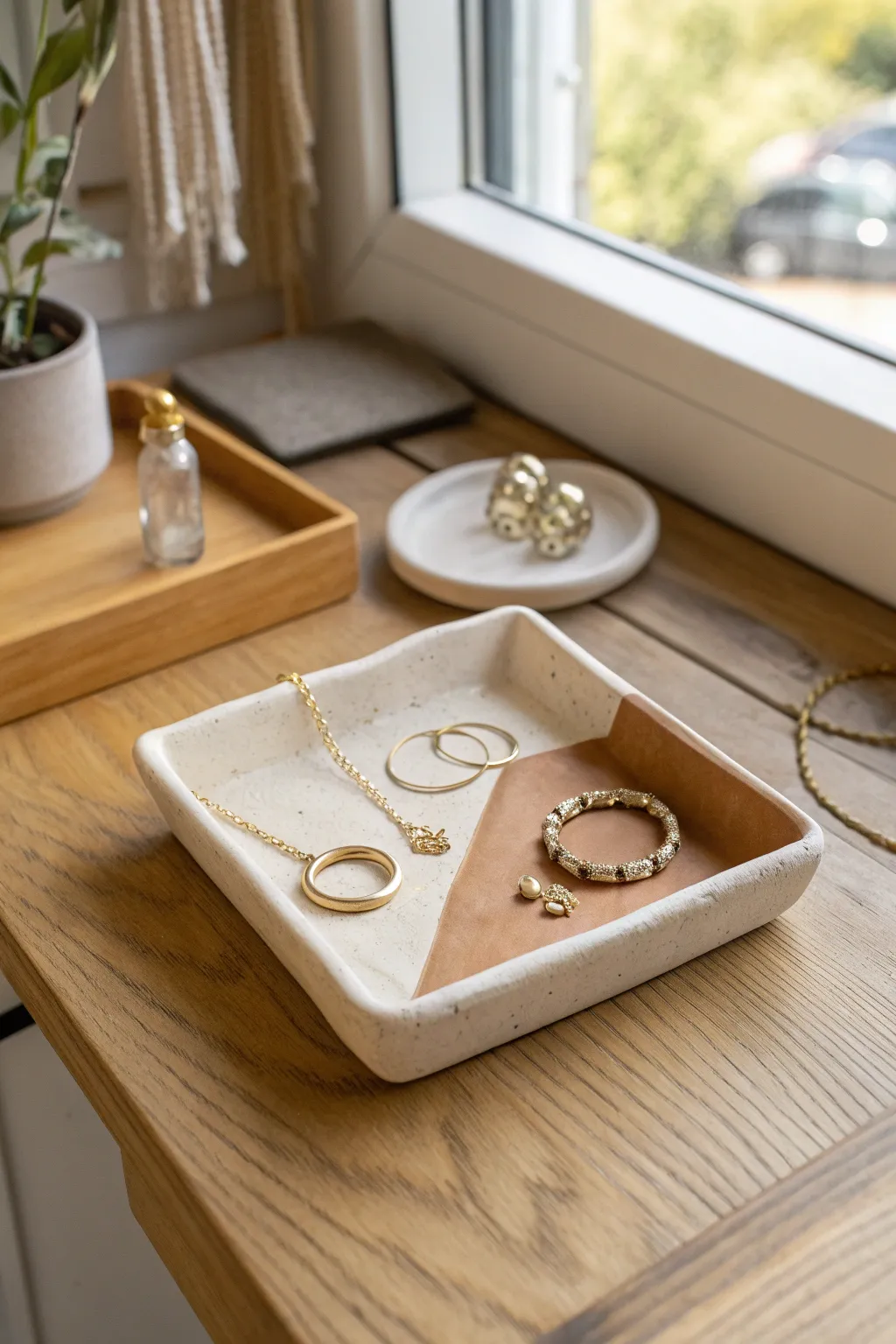Minimal folded-corner clay jewelry tray with a chic two-tone finish for everyday treasures
