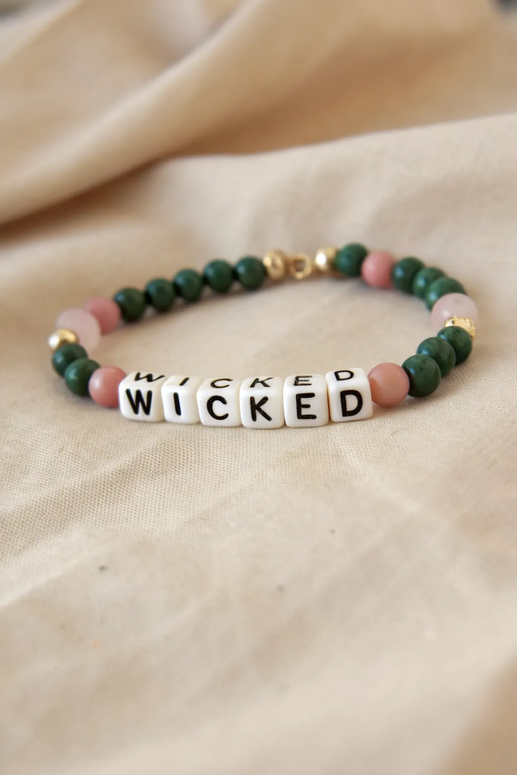 Bold WICKED centerpiece bracelet with pink and green clay beads in clean minimalist style.